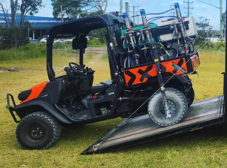 Kubota utility vehicle fitted with GPS antenna and line-marking spray units